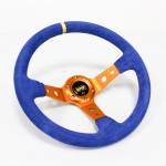 Volante desplazado OMP - Borde Gamuza azul e interior dorado / anaranjado